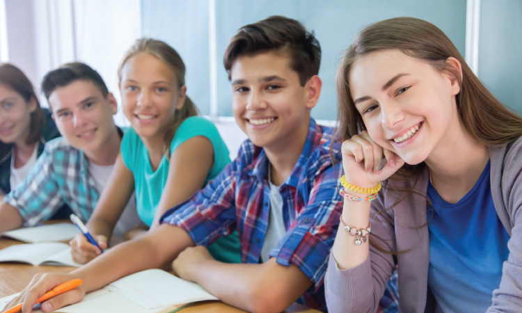 Group of smiling teenagers