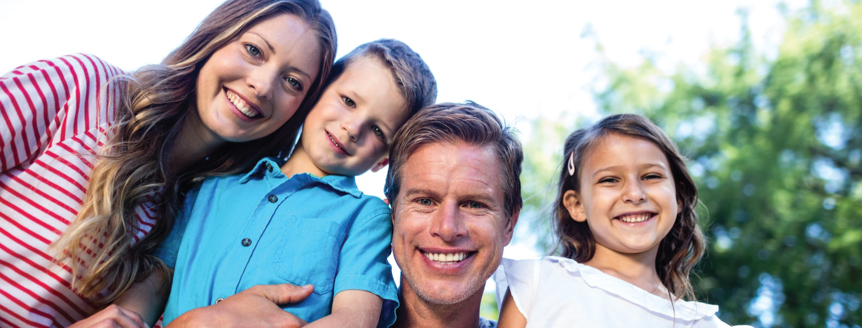 Family outdoor smiling at camera